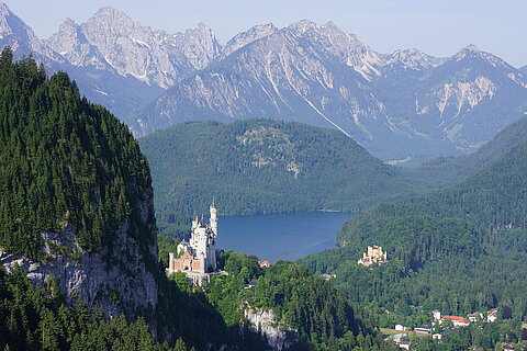 Neuschwanstein and Hohenschwangau castle with lake Alpsee in the Background
